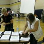 Rose Harlow Stoughton and Susan Gannon Hanzlicek check out the booklets by Kay German Bunn