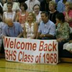 Patrick Guilfoyle, Jeanie Kramer Barnes, John Bartelsmeyer, & Pennie Hudson Province hold down our "Welcom Back" sign