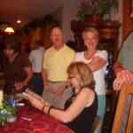 Sheryl Whiteside Bloomfield (Ft. Scott), Patrick & Sally Guilfoyle (DeSoto, KS)  look over old yearbooks with Cindy Bartelsmeyer (John's wife).